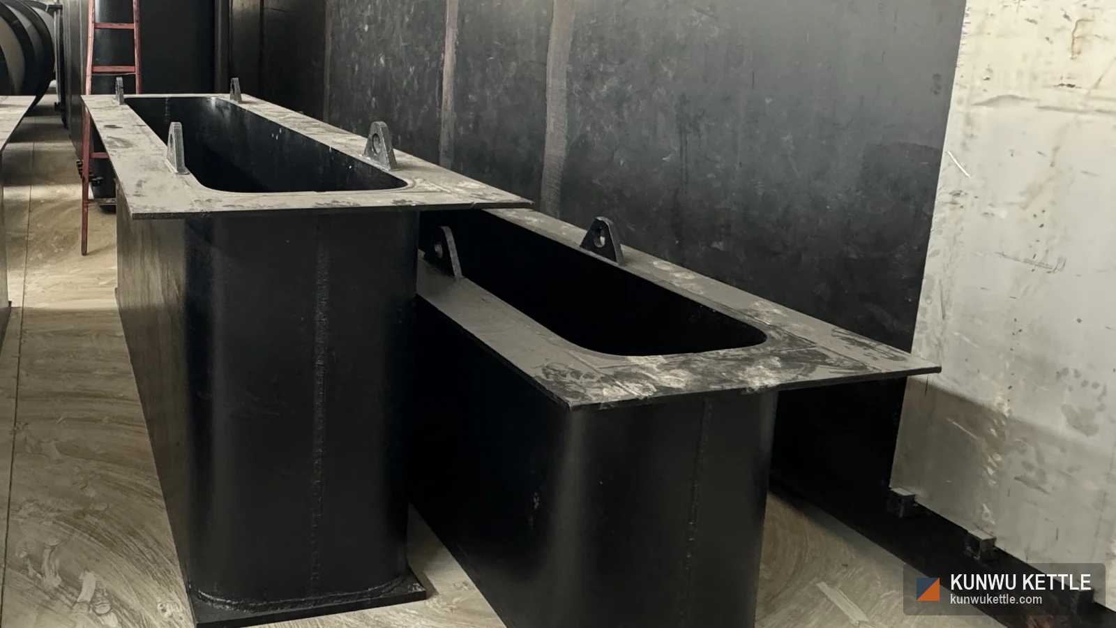 Two single flange flat bottom galvanizing kettle shells with lifting lugs in the workshop