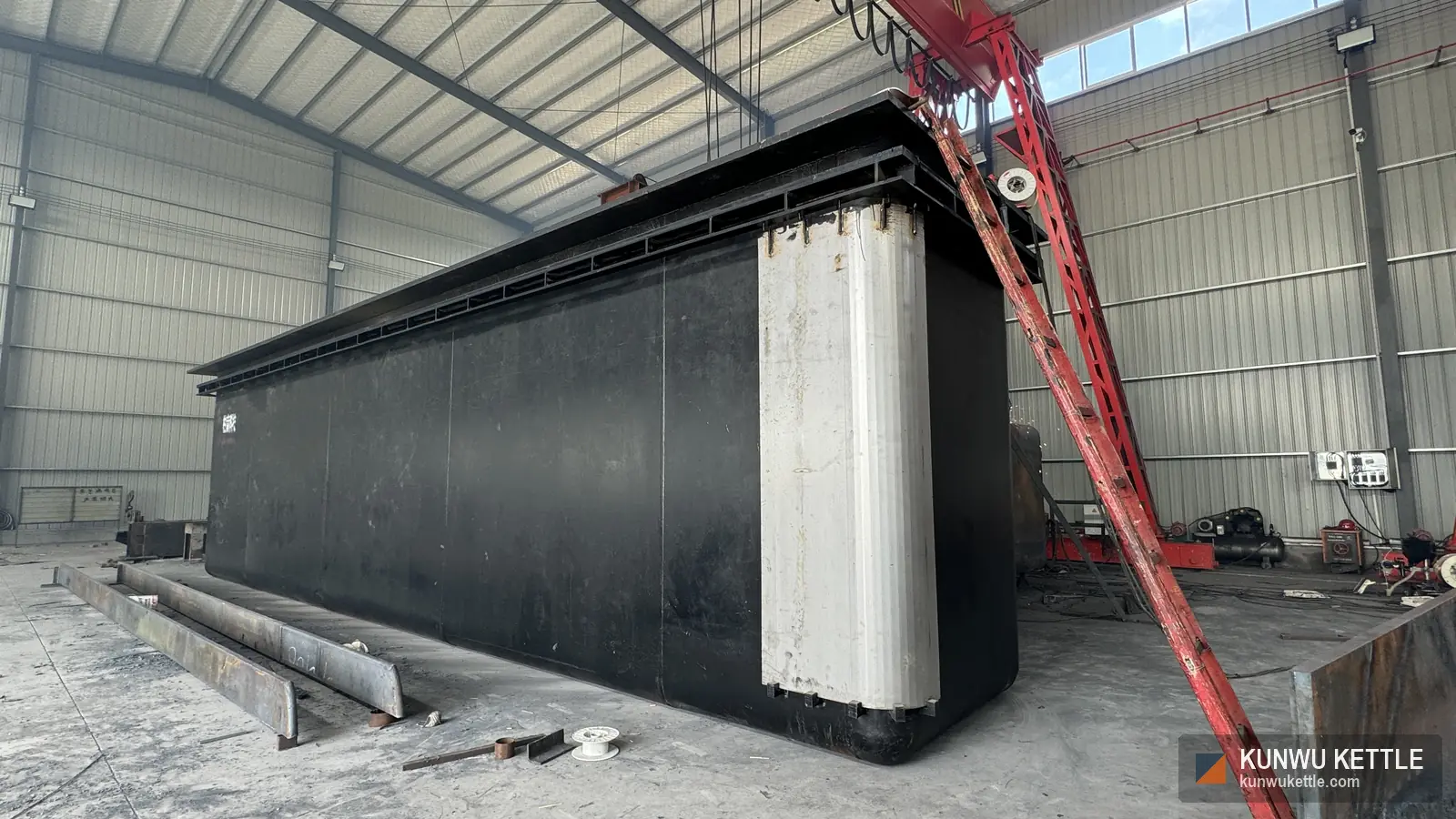 Large galvanizing kettle in the workshop with overhead gantry crane
